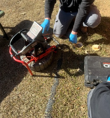 technician checking for water leak