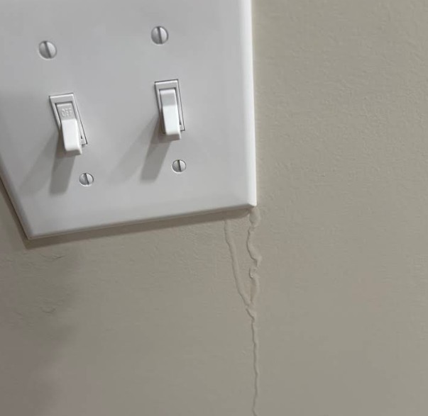 water leak next to power outlet